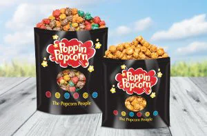 Two pouches filled with different flavors of Poppin' Popcorn.